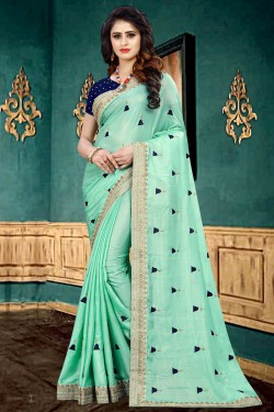 Classic Turquoise Georgette Border Work Saree With Brocade Blouse