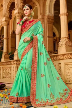 Supreme Turquoise Fancy Fabric Embroidered Saree With Fancy Fabric Blouse