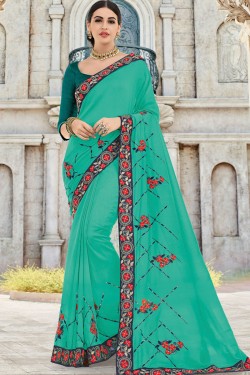 Charming Teal Silk Embroidered Party Wear Saree With Silk Blouse