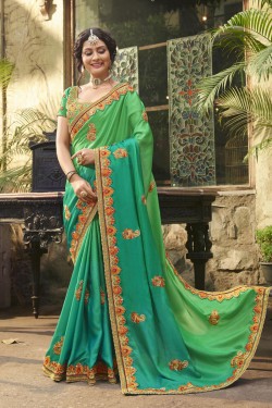 Lovely Green Crepe and Silk Embroidered Saree With Dhupion Blouse