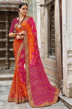 Gorgeous Orange and Pink Georgette Embroidered Party Wear Saree