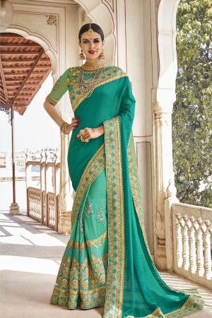 Graceful Turquoise Net and Georgette Embroidered Wedding Saree With Banglori Silk Blouse
