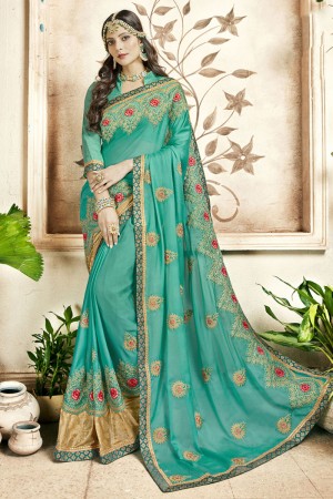 Lovely Turquoise Georgette Embroidered Saree With Banarasi Silk Blouse