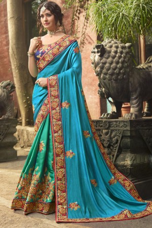 Pretty Turquoise and Sky Blue Crepe and Silk Embroidered Saree With Dhupion Blouse
